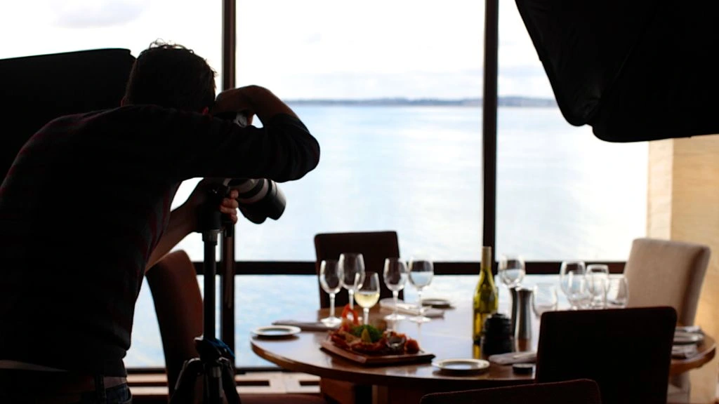 The dockhouse private dining room at Ohl's Place, with the working fireplace lit.